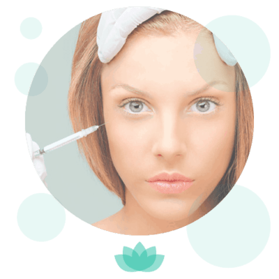 Woman receiving facial treatment with cosmetic brush application