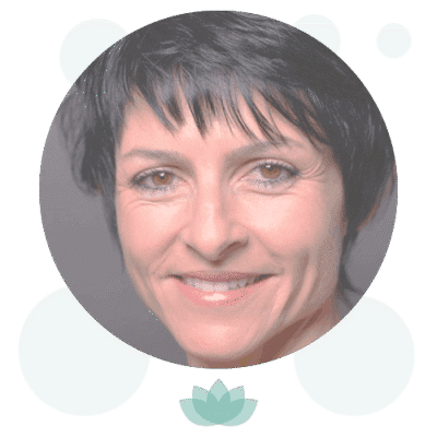 Circular portrait photo of smiling woman with dark hair