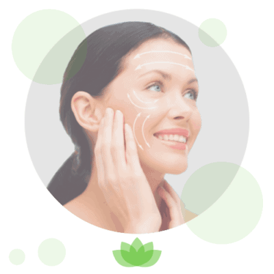 Woman applying skincare cream to face with green lotus design