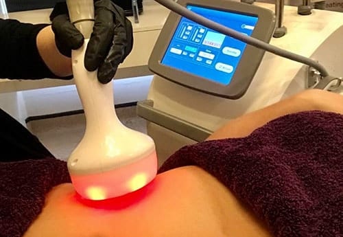 Laser therapy treatment on patient's skin with digital device