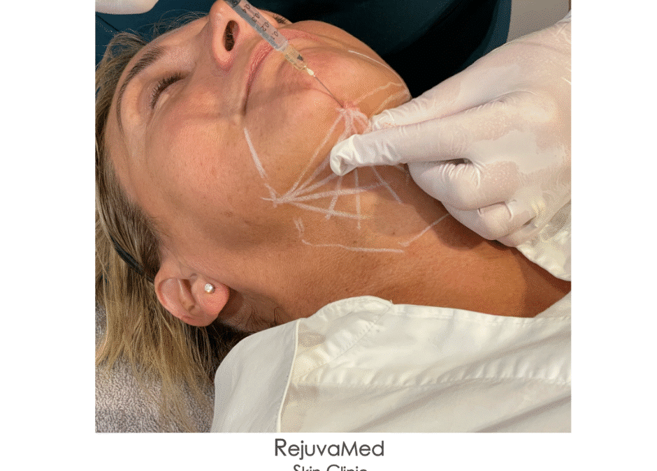 Medical professional marking facial areas for cosmetic procedure planning