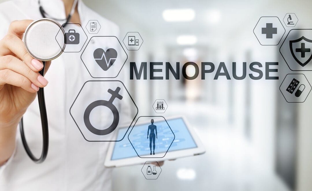 Doctor with stethoscope displaying menopause medical icons