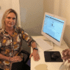 Menopausal Women Woman at desk with computer monitor and workspace