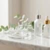 Skincare serums still life Skincare serums and hyaluronic gel on a marble shelf